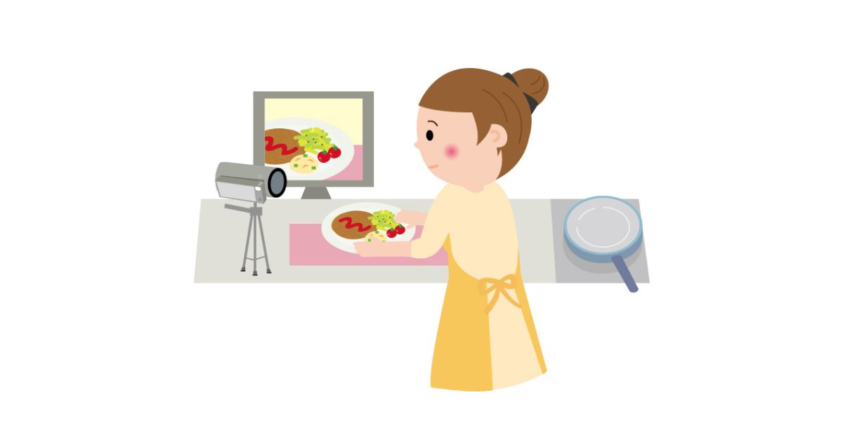 料理を撮影する女性