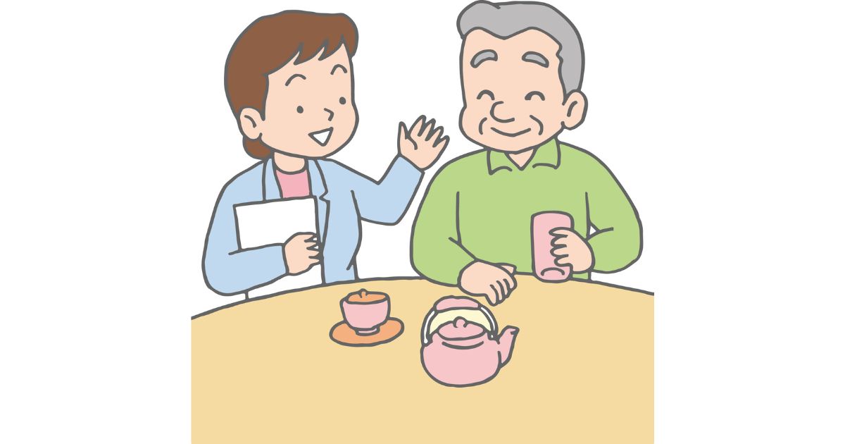 ちゃぶ台でお茶を飲みながら老人と話す女性