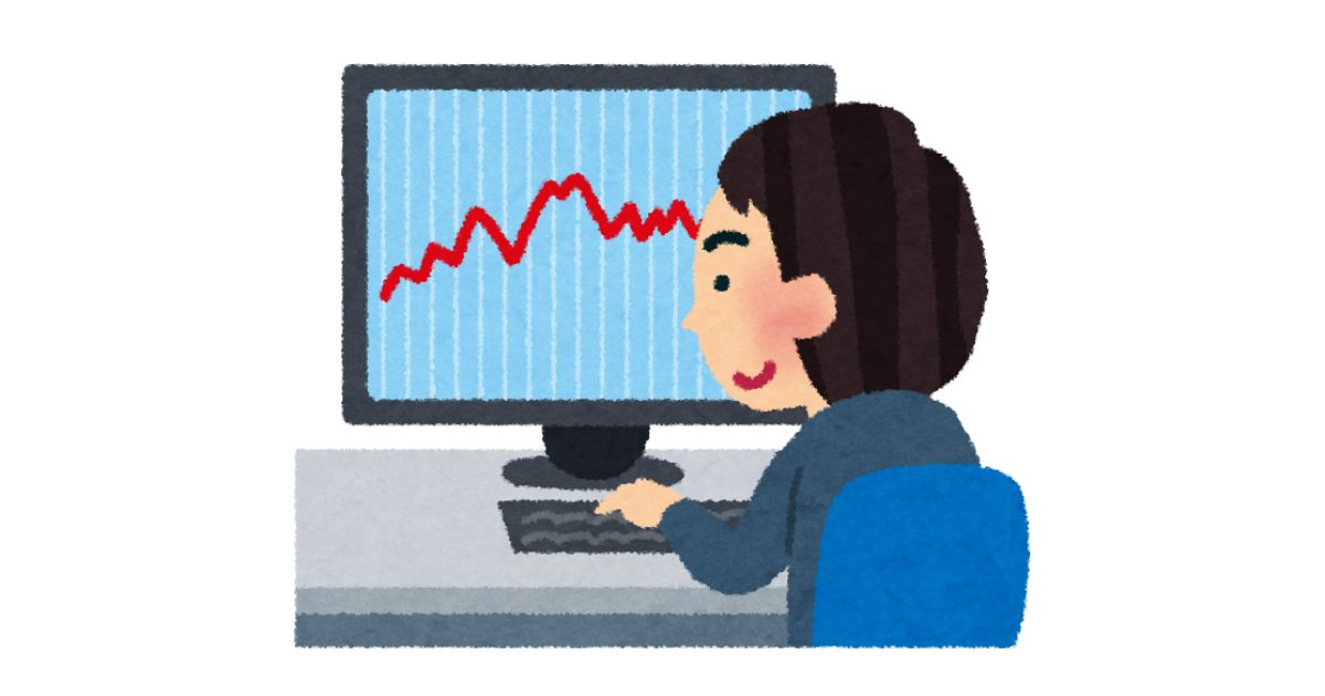 パソコンの画面に表示された価格変動のグラフを見つめる男性